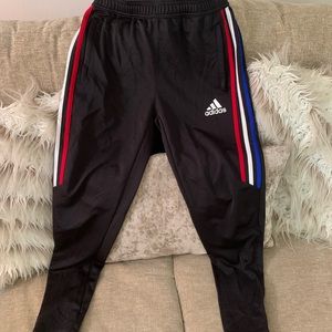 Boys Addias track pants.